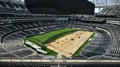Workers install turf on the pitch at the Los Angeles Stadium, temporarily renamed from SoFi Stadium, in Inglewood, California for the World Cup. AFP