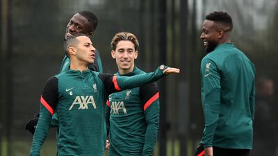 Thiago Alcantara shares a joke with Divock Origi. Getty