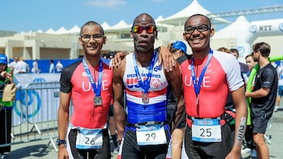 Special Olympics ITU Traiathlon at the YAS Marina Circuit. (L-R) Micah Hambleton (UAE), Trent Hamton (USA) and Jonah Hambleton (UAE) after the triathlon. Victor Besa / The National
