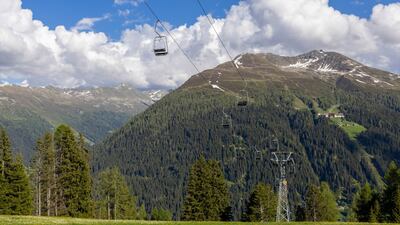 Chairlifts in Davos, Switzerland. There was notably little snow in the Alps in February. Bloomberg