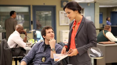 Andy Samberg, left, and Melissa Fumero in Brooklyn Nine Nine. AP Photo / Fox, Beth Dubber.