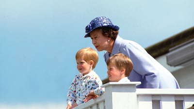 The queen with Prince William and Prince Harry watch a polo match in Windsor in 1987. Getty