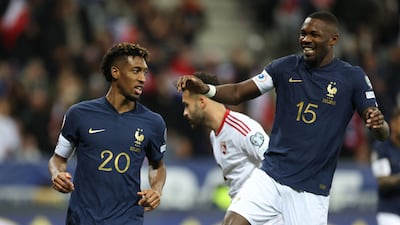France's Kingsley Coman celebrates with Marcus Thuram. AP