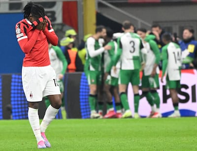 AC Milan forward Rafael Leao reacts as Feyenoord players celebrate their during Champions League knockout phase playoffs win. EPA