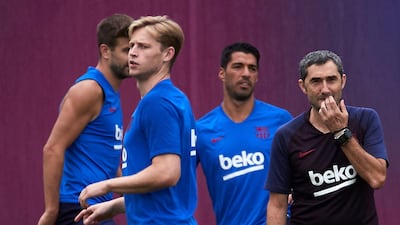 Barcelona forward Luis Saurez, second right, joins his Barcelona teammates in training at Joan Gamper's sport city in Barcelona. EPA