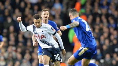 Tottenham Hotspur midfielder Dele Alli, left, vies with Leicester City's Polish defender Marcin Wasilewski during the FA Cup third-round football match at White Hart Lane in north London on January 10, 2016. AFP PHOTO / OLLY GREENWOOD