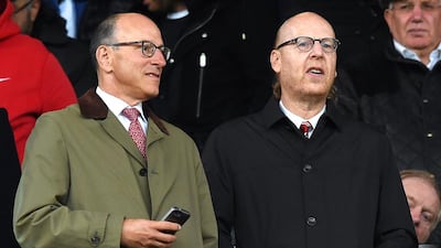 Manchester United’s co-chairmen Joel Glazer, left, and Avram Glazer attend a Premier League match at Old Trafford in England. PA