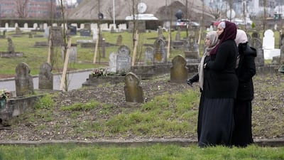Women looks on the ceremony. Joel Saget / AFP Photo