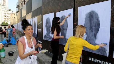 Activists hang portraits of August 4 Beirut blast victims on a wall in the Lebanese capital. Artist Brady Black, in partnership with the Art of Change organisation, commemorated the deadly explosion that killed more than 200 people. EPA