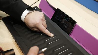 People try out the Roli Seaboard Rise at CES Unveiled, a media preview event for CES International. The MIDI controller connects to a mobile device or computer to allow you to create music. John Locher / AP Photo