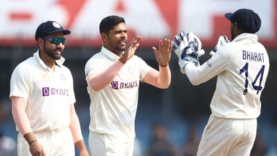 India's Umesh Yadav, centre, took 3-12 to help bowl out Australia for 197 in their first innings. Getty