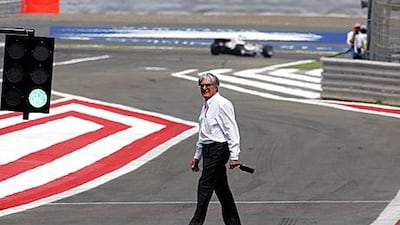 Bernie Ecclestone crosses the pitlane at the Bahrain Grand Prix in 2006. The May 1 deadline on whether Bahrain hosts a grand prix may be put back further.