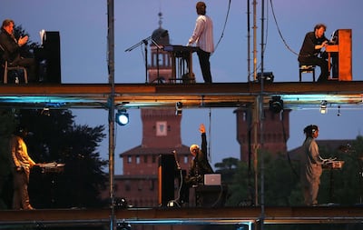 Ludovico Einaudi, Maurizio Ben Omar, Michiel Bortslop, Naby Camara, Fassery Diabate, Losana Diabate, Lansine Kouyate, Gianluca Mancini, Federico Mecozzi, Cesare Picco and Andrea Rebaudengo performs at Piano City Milano Music Festival on May 16, 2014 in Milan, Italy. Getty Images