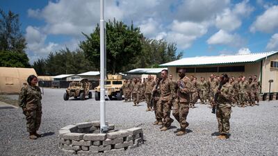 US Air Force personnel conduct a flag-raising ceremony at Camp Simba in Lamu, Kenya, in August 2019. EPA