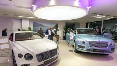 A Continental GT and Bentayga V8 get some attention. Chris Whiteoak / The National