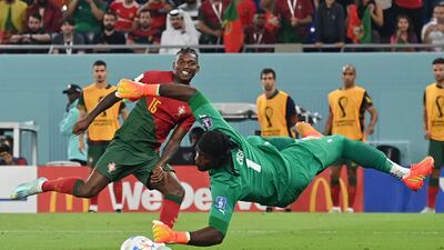 Rafael Leao, left, scores his team's third goal past Lawrence Ati-Zigi, right. AFP