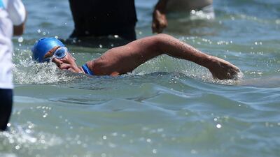 Ms Nyad, 64, swam up to the beach just before 2pm EDT (9pm UAE), about 53 hours after starting her journey from Havana on Saturday. J Pat Carter / AP Photo