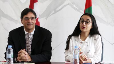 Alia Al Mansoori, who won the Genes in Space competition, meets the Canadian ambassador to the UAE, Masud Husain. Pawan Singh / The National