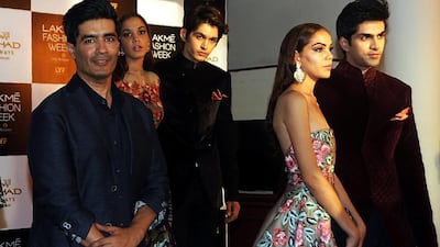 Indian designer Manish Malhotra, left, with models wearing his creations. AFP