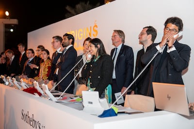 Ashkan Baghestani, Sotheby’s head of sale for fine art, (far right) says that modern and contemporary Arab art exceeded his expectations. Getty Images