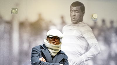 Chelsea's first Black player, Paul Canoville, in front of a photograph of his in his playing days, in London on November 28, 2021.