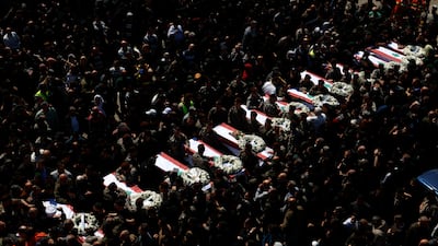 Mourners gather around the coffins of thirteen bodies from the Lebanese State Security Forces members killed in an Israeli attack during a funeral procession in the southern coastal city of Sidon. EPA