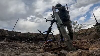 A Russian serviceman fires a mortar during fighting in the Kharkiv region, Ukraine. EPA / Russian Defence Ministry