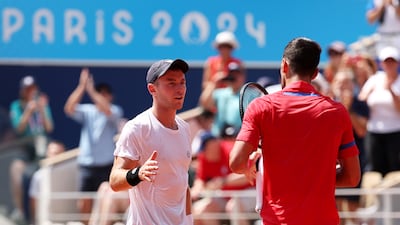 Dominik Koepfer of Germany shakes hands with Novak Djokovic of Serbia after their match. Getty Images