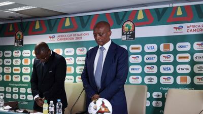 Confederation of African Football President Patrice Motesepe observes a minute of silence before a press conference on January 25 at Ahmadou Ahidjo stadium in Yaounde, in which eight people were killed and many more injured. AFP