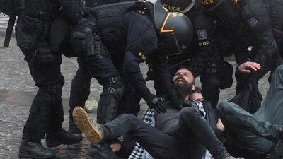 Riot police move in against protestors at the Old Town Square as hundreds of demonstrators, mostly football supporters, protest against the Czech government's new measures to slow the spread of the Covid-19 coronavirus in Prague. AFP