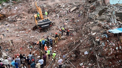 Rescue workers search for survivors in the rubble of a collapsed five-storey apartment building in the town of Mahad, about 170 kilometres south of India's financial capital of Mumbai. AFP