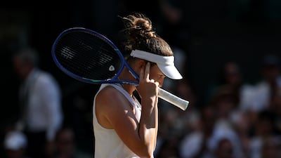 Linda Noskova covers her ears as she walks back to her chair on the way to losing the second set against Karolina Muchov. Getty Images