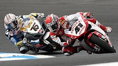Noriyuki Haga, right, leads Max Neukirchner around the Phillip Island circuit in the first race of the day.