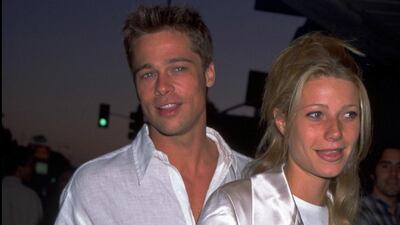 Brad Pitt, in a white linen shirt, and Gwyneth Paltrow attend the 'Living in Oblivion' premiere on July 12, 1995 at the Royal Theatre in West Los Angeles, California. Getty Images