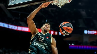 Walter Tavares of Real Madrid dunks the ball. He led the way with 20 points for Madrid in a 98-95 overtime win over Dubai Basketball.