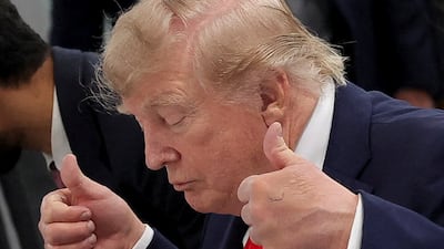 US President Donald Trump gestures during a working session with G7 leaders and partners in Evian-les-Bains, France on Tuesday. Reuters