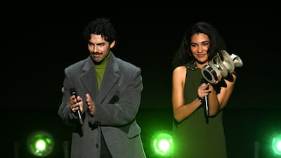 Singers Joe Jonas and Olivia Dean present the BFC Foundation Award