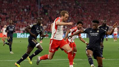 Bayern Munich striker Harry Kane is challenged by Real Madrid midfielder Aurelien Tchouameni during the Uefa Champions League semi-final first leg match at Allianz Arena on April 30, 2024 in Munich, Germany. Getty Images