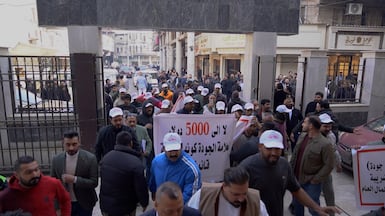 Iraqi traders protest outside the Baghdad Chamber of Commerce on Thursday against new taxes and customs tariff. Aymen Al Ameri / The National