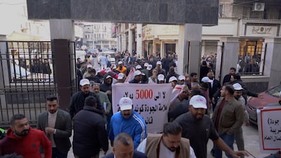 Iraqi traders protest outside the Baghdad Chamber of Commerce on Thursday against new taxes and customs tariff. Aymen Al Ameri / The National