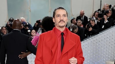 Pedro Pascal bares his legs in red and black. AFP