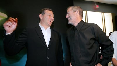 Apple CEO Steve Jobs, right, shares a laugh with Walt Disney CEO Bob Iger during an Apple media event on September 12, 2006 in San Francisco. Justin Sullivan /Getty Images / AFP