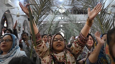Christian devotees attend the Palm Sunday service at St Anthony Church in Lahore. AFP