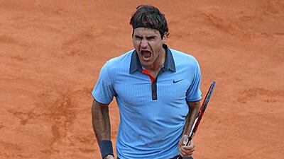 Roger Federer roars with delight and relief after winning his French Open semi-final against Juan Martin del Potro in five sets.