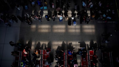 Passengers gather in the waiting hall at Hongqiao Railway Station ahead of the Lunar New Year holidays in Shanghai. Johannes Eisele / AFP