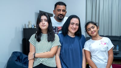 Mai Hamed with husband Amir and daughters, Jana,12, and Salma, 9. Victor Besa / The National