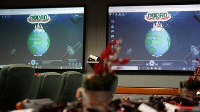 Monitors are illuminated in the Norad Tracks Santa centre at Peterson Air Force Base, Monday, Dec. 23, 2019. AP