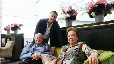 Mansour Cheikh El Ard, owner of Granny's Waffles with his parents at the Dubai Mall in Dubai. He allowed his tenant stay rent-free in a villa. Pawan Singh / The National