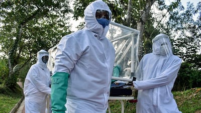 Health workers in Puerto Carreno, in the Colombian Amazon, carry a Covid-19 patient on a stretcher. AFP