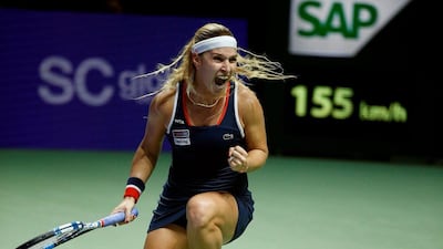 Dominika Cibulkova of Slovakia celebrates after defeating Simona Halep of Romania. Edgar Su / Reuters / October 27, 2016